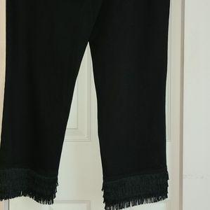 Inc black jeans with  back & front pockets & fringe trim at the bottom.